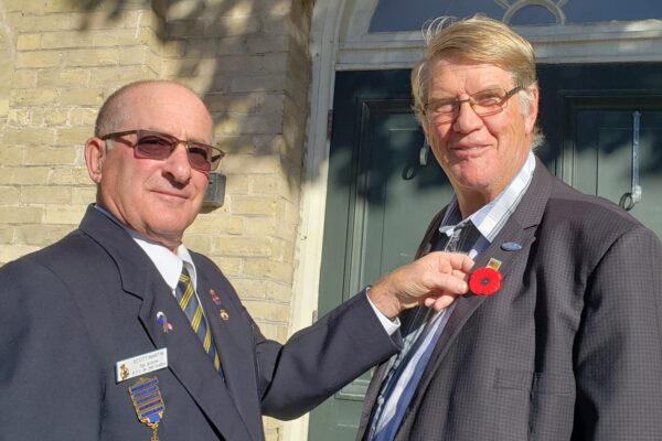 First Poppy pinned on Mayor John Logel