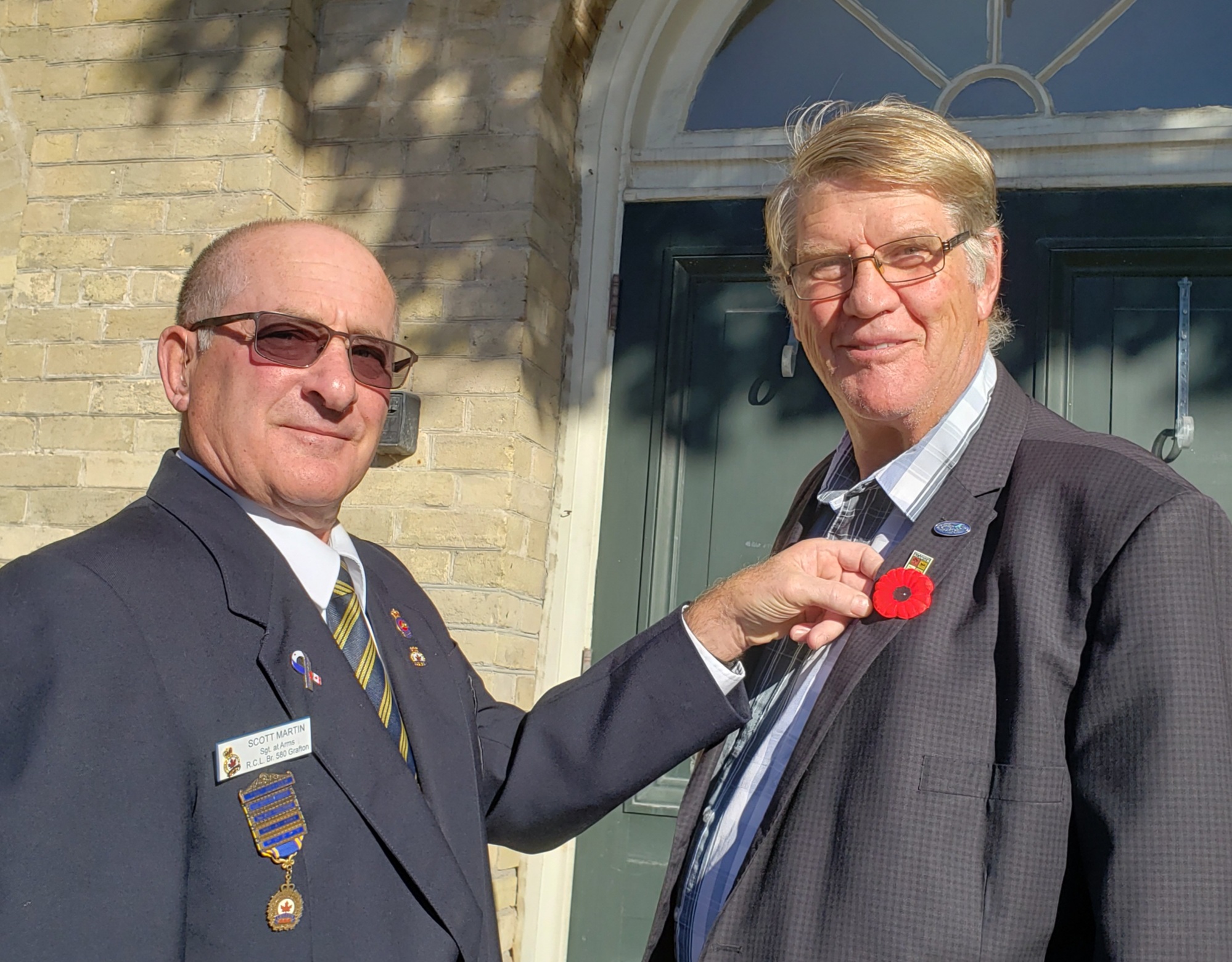 First Poppy pinned on Mayor John Logel